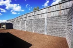 Sunset Sleepers The Arizona Block Face Charcoal Concrete Sleepers on a High Backyard Retaining Wall somewhere in Melbourne VIC