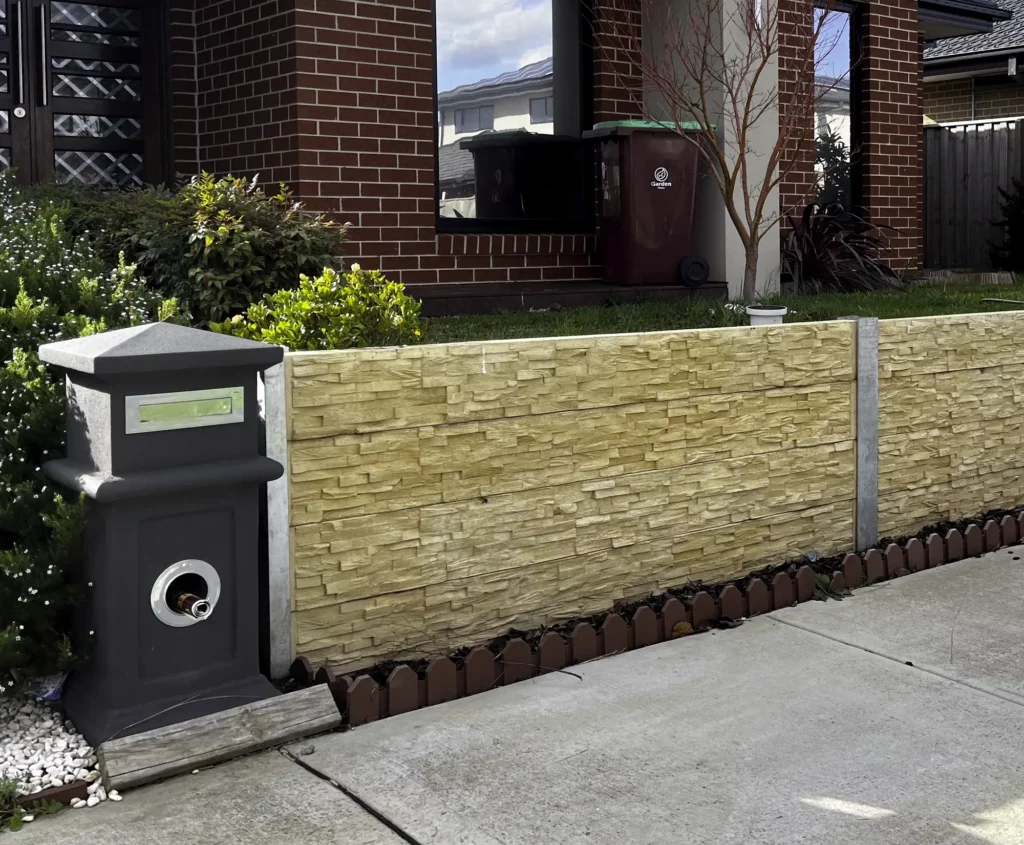 Yellow Colour Concrete Sleeper with Stack Stone Pattern on a Front Yard Retaining Wall using Sunset Sleepers The Manhattan Sandstone Concrete Sleepers Gallery Item 2