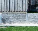 Charcoal Stackedstone Concrete Sleepers Used as Under Fence Plinth for Timber Fence Project across Melbourne and Victoria by Sunset Sleepers