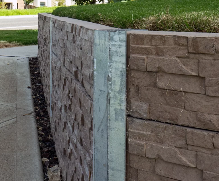 45 Degree Galvanised Steel Angle Posts featuring Jasper Brown Manhattan Stacked Stone Concrete Sleeper by Sunset Sleepers