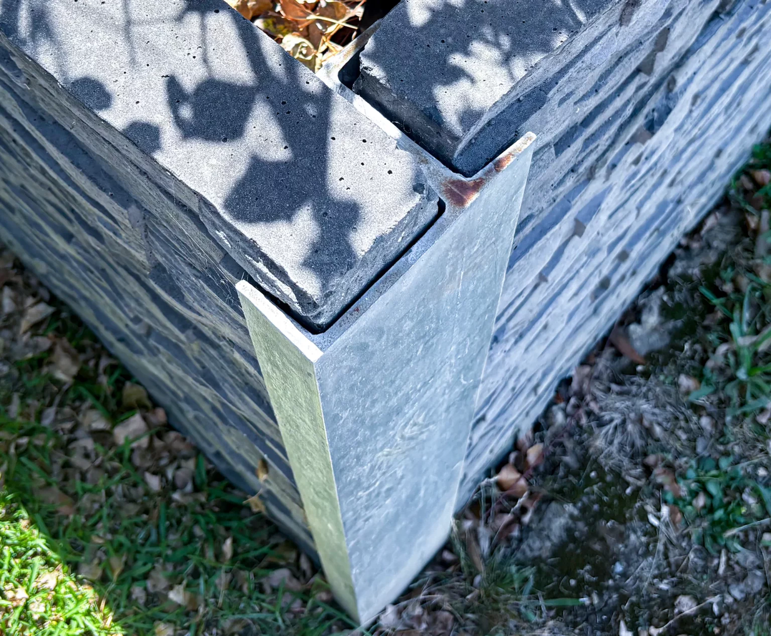 90 Degree Right Angle Corner Galvanised Steel Post featuring Charcoal Manhattan Stacked Stone Concrete Sleeper by Sunset Sleepers Top View
