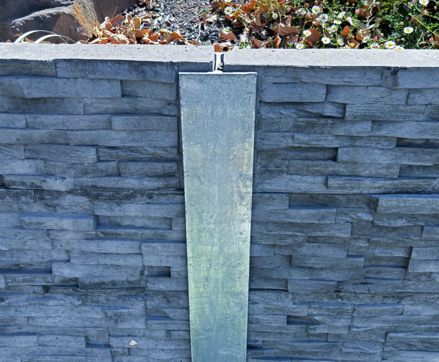 H Channel Middle Joiner Galvanised Steel Post featuring Charcoal Brown Manhattan Stacked Stone Concrete Sleeper by Sunset Sleepers