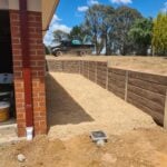 Jamesco Group Boundry Retaining Wall in Melbourne using Jasper Brown Malibu Woodgrain Concrete Sleepers Supplied by Sunset Sleepers
