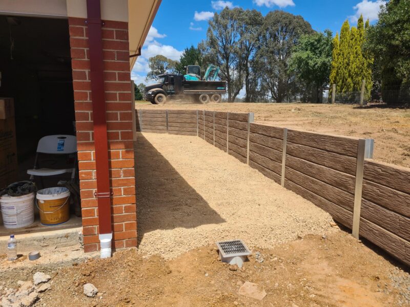 Jamesco Group Boundry Retaining Wall in Melbourne using Jasper Brown Malibu Woodgrain Concrete Sleepers Supplied by Sunset Sleepers