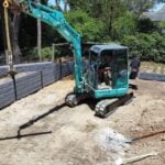 Jamesco Group Building a Retaining Wall in Melbourne using Charcoal Malibu Charcoal Concrete Sleepers Supplied by Sunset Sleepers