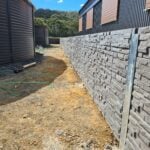 Jamesco Group Newley Built Retaining Wall in Melbourne using Charcoal Manhattan Stackedstone Concrete Sleepers Supplied by Sunset Sleepers