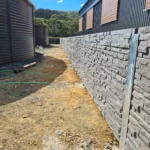 Jamesco Group Newley Built Retaining Wall in Melbourne using Charcoal Manhattan Stackedstone Concrete Sleepers Supplied by Sunset Sleepers