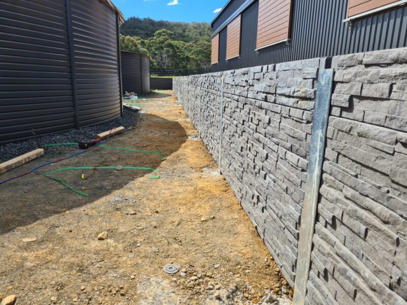 Jamesco Group Newley Built Retaining Wall in Melbourne using Charcoal Manhattan Stackedstone Concrete Sleepers Supplied by Sunset Sleepers