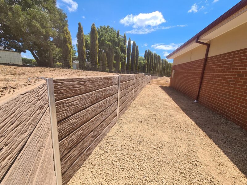 Jamesco Group Newley Built Retaining Wall in Melbourne using Jasper Brown Malibu Woodgrain Concrete Sleepers Supplied by Sunset Sleepers