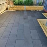 Backyard Paving and Feature Retaining Wall Using Sandstone Yellow Arizona Block Face Concrete Sleepers Constructed by Dream View Landscape and Supplied by Sunset Sleepers