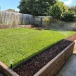 Backyard Retaining Wall Constructed by Dream View Landscape Using Jasper Malibu Woodgrain Concrete Sleepers and Supplied by Sunset Sleepers