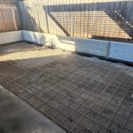 Backyard Retaining Wall Under Construction by Dream View Landscape Using Plain Grey Marina Smooth Concrete Sleepers and Supplied by Sunset Sleepers