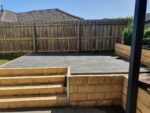 Backyard Steps Feature Retaining Wall Using Sandstone Yellow Arizona Block Face Concrete Sleepers Constructed by Dream View Landscape and Supplied by Sunset Sleepers