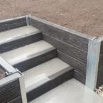 Backyard Steps Retaining Wall Constructed by Dream View Landscape Using Charcoal Malibu Woodgrain Concrete Sleepers and Supplied by Sunset Sleepers