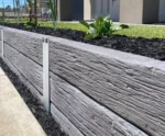 Charcoal Malibu Woodgrain Concrete Sleepers on Small Front Yard Retaining Wall Supplied by Sunset Sleepers