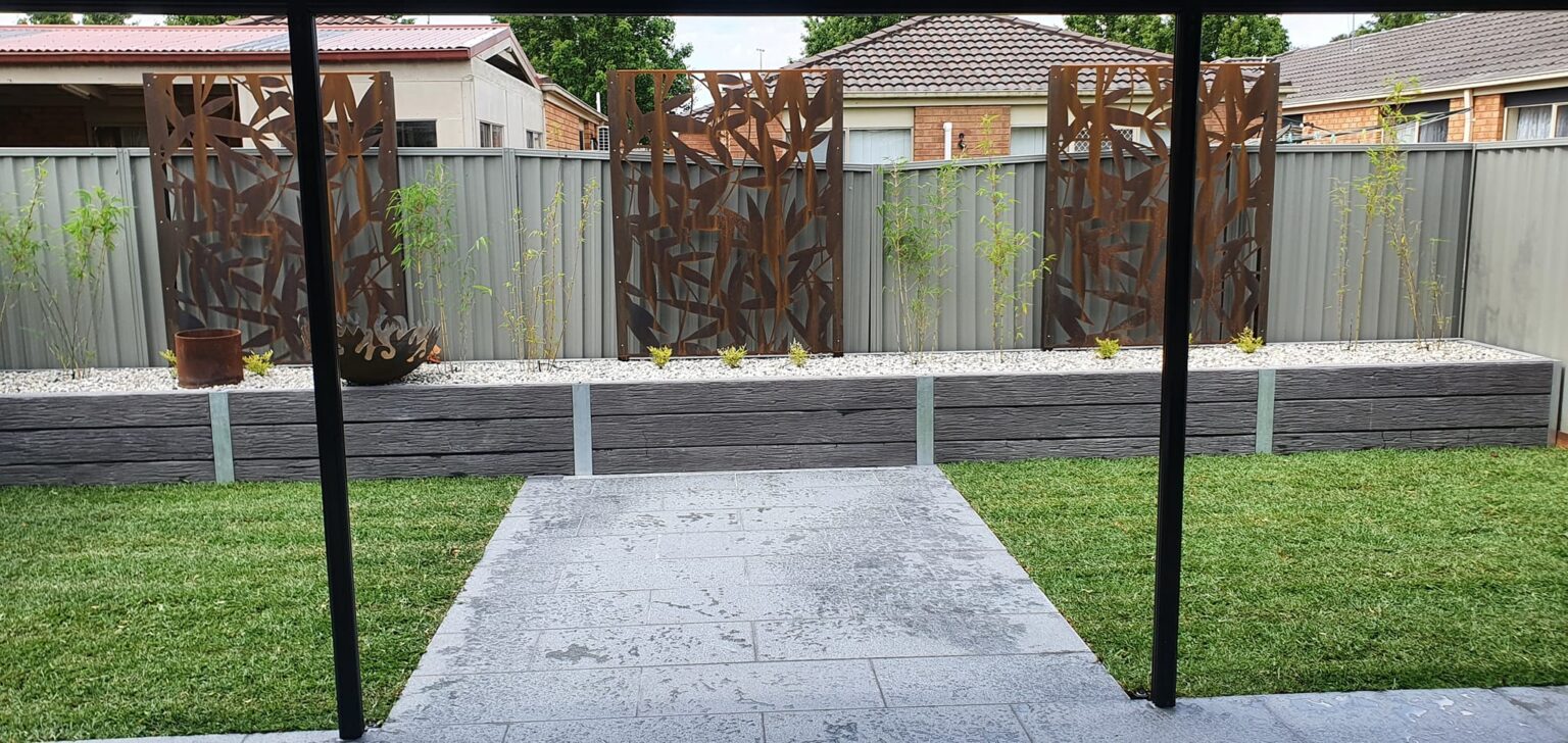 Completed Backyard Garden Bed Feature Retaining Wall by Dream View Landscape Using Charcoal Malibu Woodgrain Concrete Sleepers and Supplied by Sunset Sleepers