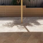 Completed Backyard Retaining Wall and Painted Yellow Using Plain Marina Smooth Concrete Sleepers by Dream View Landscape and Supplied by Sunset Sleepers
