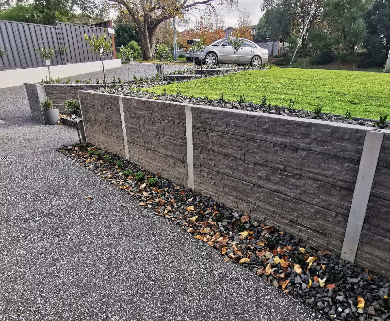 Completed Drive Way Retaining Wall Project in Melbourne Using the Charcoal Manhattan Stacked Stone Concrete Sleepers Supplied by Sunset Sleepers