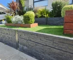 Completed Front Yard Garden Bed Project Using the Charcoal Manhattan Stacked Stone Concrete Sleepers Finished of with the Auseal EC25 Bluestone Charcoal Sealer