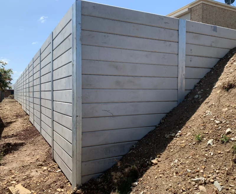 Completed Tall Heavy Duty Retaining Wall Project Using The Plain Marina Smooth Concrete Sleepers - Constructed by the team at JBS Retaining Walls & Excavations and Supplied by Sunset Sleepers
