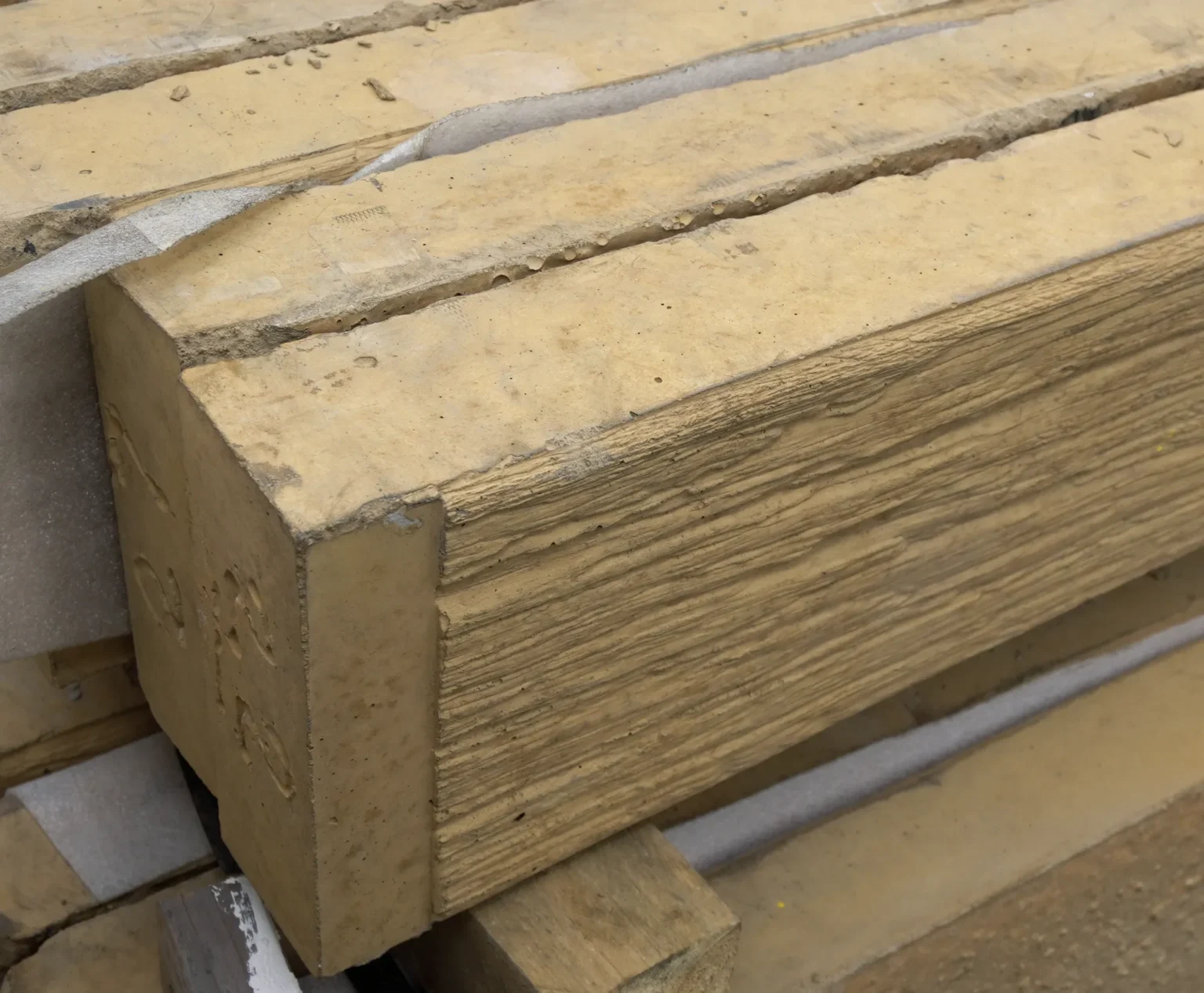 Detailed Close Up of Sandstone Yellow Woodgrain The Malibu Concrete Sleeper Stock in Sunset Sleepers Officer Yard