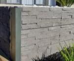 Detailed Close Up of a Small DIY Retaining Wall Project for a Front Yard Garden Bed in Melbourne Using the Charcoal Manhattan Stacked Stone Concrete Sleepers