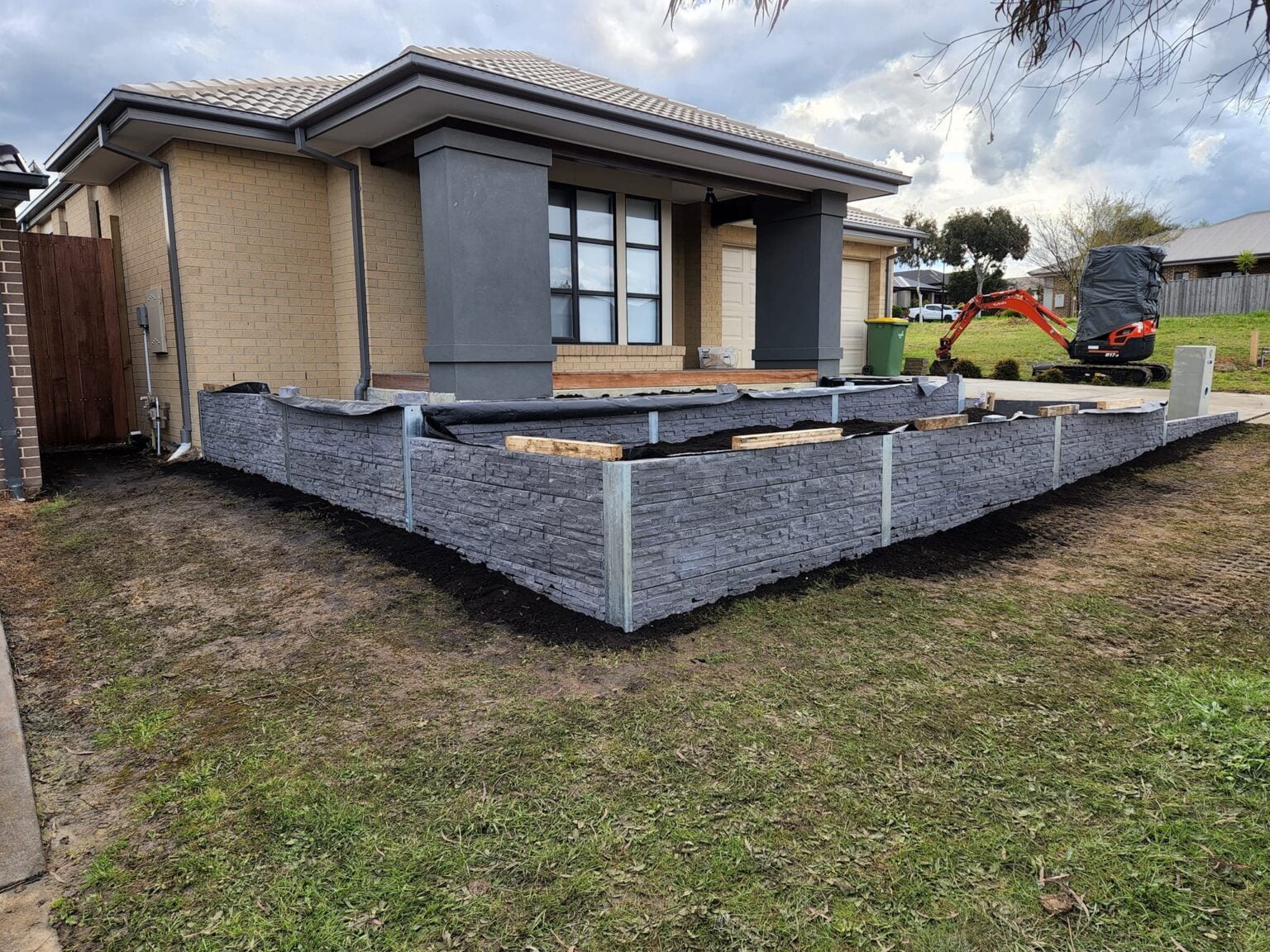Front Yard Retaining Wall Built Dream View Landscape Using Charcoal Manhattan Stacked Stone Sleepers and Supplied by Sunset Sleepers