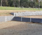 Large Rural Retaining Wall Project in Progress in Melbourne Using the Charcoal Manhattan Stacked Stone Concrete Sleepers Supplied by Sunset Sleepers