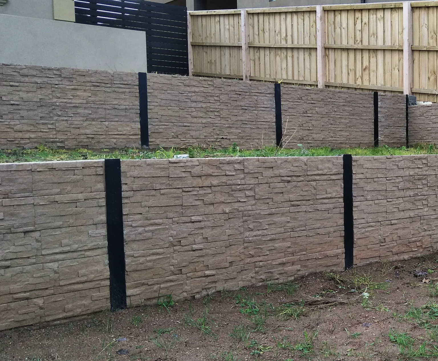Newly Built Backyard Boundary Retaining Wall Project in Melbourne Using the Jasper Brown Manhattan Stacked Stone Concrete Sleepers Supplied by Sunset Sleepers