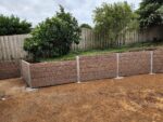 Newly Built Backyard Retaining Wall by Dream View Landscape Using Jasper Brown Malibu Woodgrain Concrete Sleepers and Supplied by Sunset Sleepers