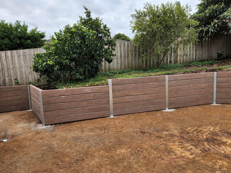 Newly Built Backyard Retaining Wall by Dream View Landscape Using Jasper Brown Malibu Woodgrain Concrete Sleepers and Supplied by Sunset Sleepers