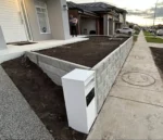 Newly Built Retaining Wall in Front Yard for a New Home Using the Ash Arizona Block Face Concrete Sleepers Built by Ferguson Landscape & Design and Supplied by Sunset Sleepers