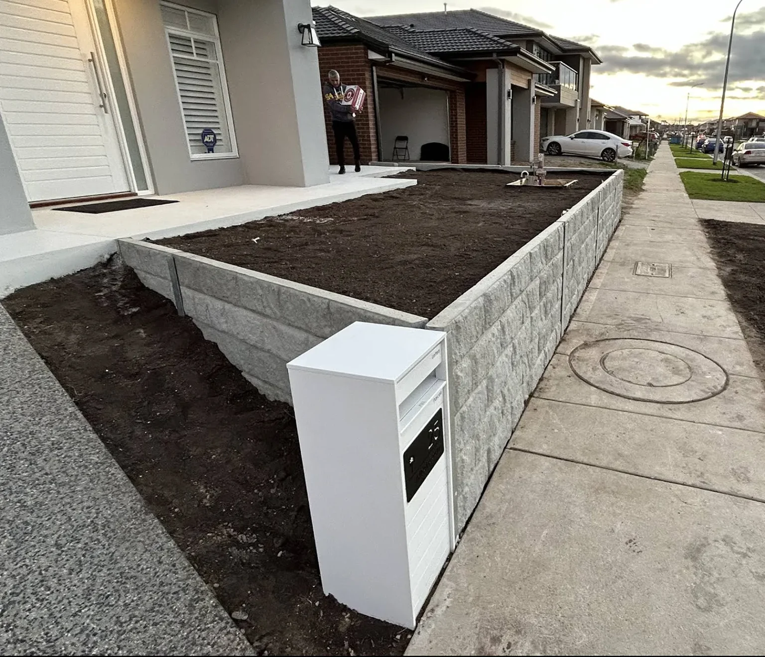 Newly Built Retaining Wall in Front Yard for a New Home Using the Ash Arizona Block Face Concrete Sleepers Built by Ferguson Landscape & Design and Supplied by Sunset Sleepers