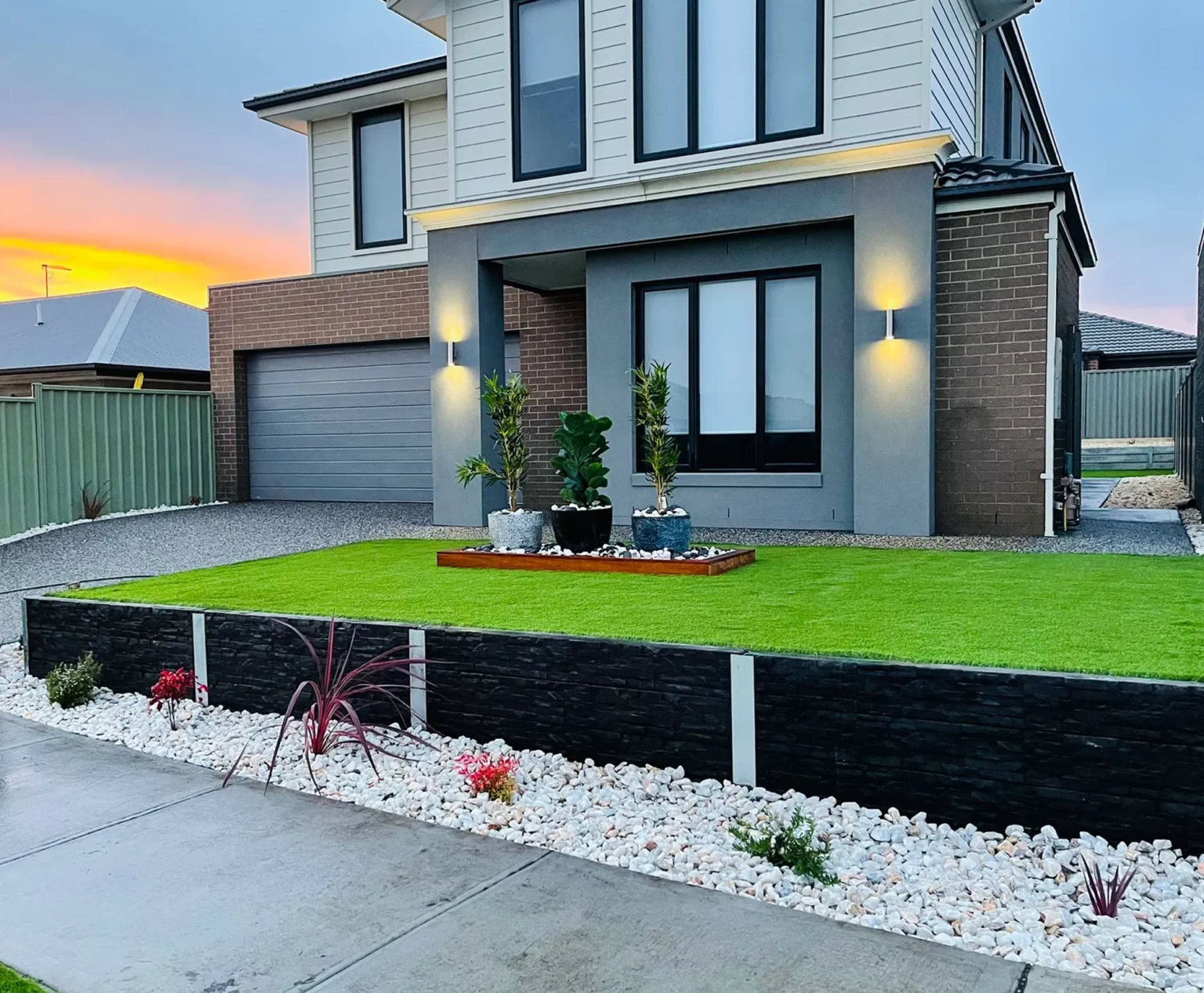Newly Constructed Small Front Yard Retaining Wall Project Using The Manhattan Charcoal Stacked Stone Concrete Sleeper and Auseal EC25 Bluestone Charcoal Sealer
