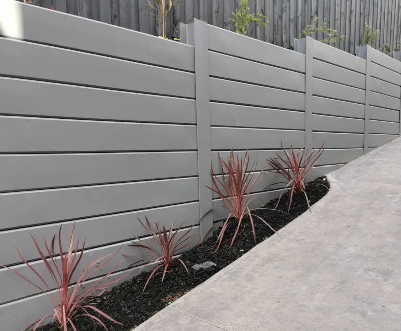 Painted Grey Plain Smooth Concrete Sleepers in The Marina Range used in Unit Development Retaining Wall Project and Supplied by Sunset Sleepers