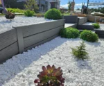 Painted Malibu Woodgrain Concrete Sleepers On a small Garden Retaining Wall Project and Supplied by Sunset Sleepers