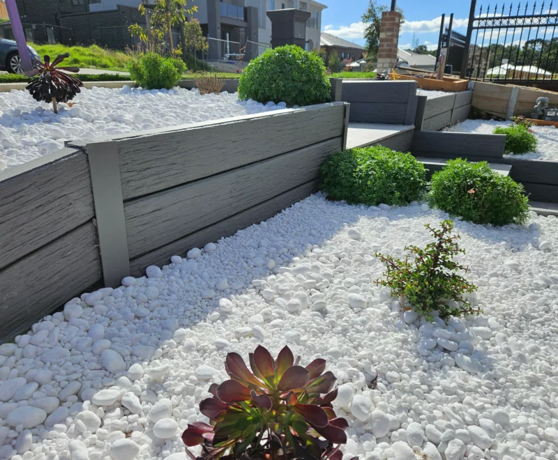Painted Malibu Woodgrain Concrete Sleepers On a small Garden Retaining Wall Project and Supplied by Sunset Sleepers