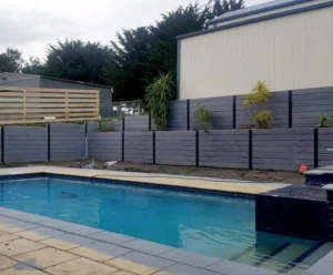Retaining Wall Project Surrounding Pool Area Using The Charcoal Marina Smooth Concrete Sleepers and Supplied by Sunset Sleepers