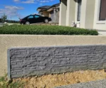 Small Charcoal Stacked Stone Manhattan Concrete Sleepers Installed on Driveway Boundry Wall in Melbourne and Supplied by Sunset Sleepers