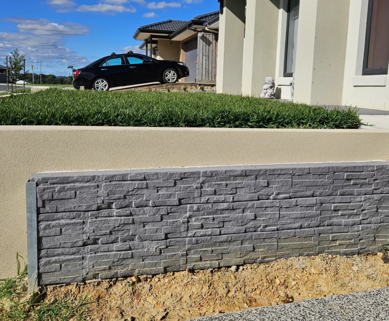 Small Charcoal Stacked Stone Manhattan Concrete Sleepers Installed on Driveway Boundry Wall in Melbourne and Supplied by Sunset Sleepers