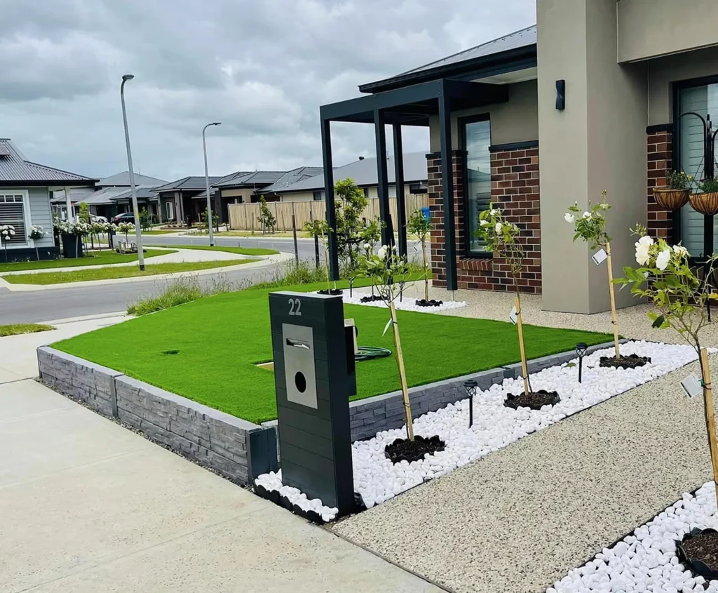 Small DIY Retaining Wall in Front Yard Using the The Manhattan Charcoal Stacked Stone Concrete Sleepers and Supplied by Sunset Sleepers