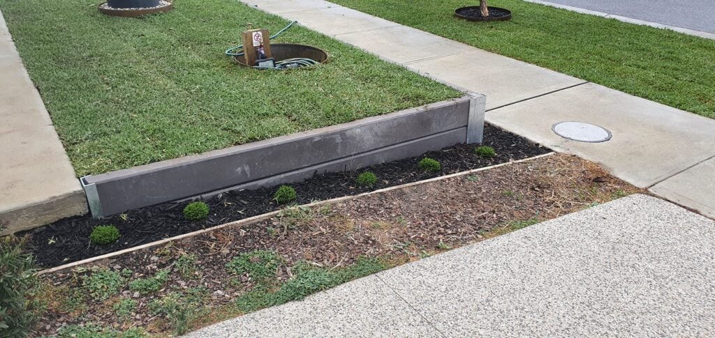 Small Front Yard Edging Retaining Wall Built Dream View Landscape Using Charcoal Marina Smooth Concrete Sleepers and Supplied by Sunset Sleepers