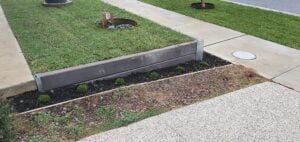 Small Front Yard Edging Retaining Wall Built Dream View Landscape Using Charcoal Marina Smooth Concrete Sleepers and Supplied by Sunset Sleepers