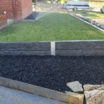 Small Front Yard Law Retaining Wall Using Charcoal Malibu Woodgrain Concrete Sleepers Built Dream View Landscape and Supplied by Sunset Sleepers