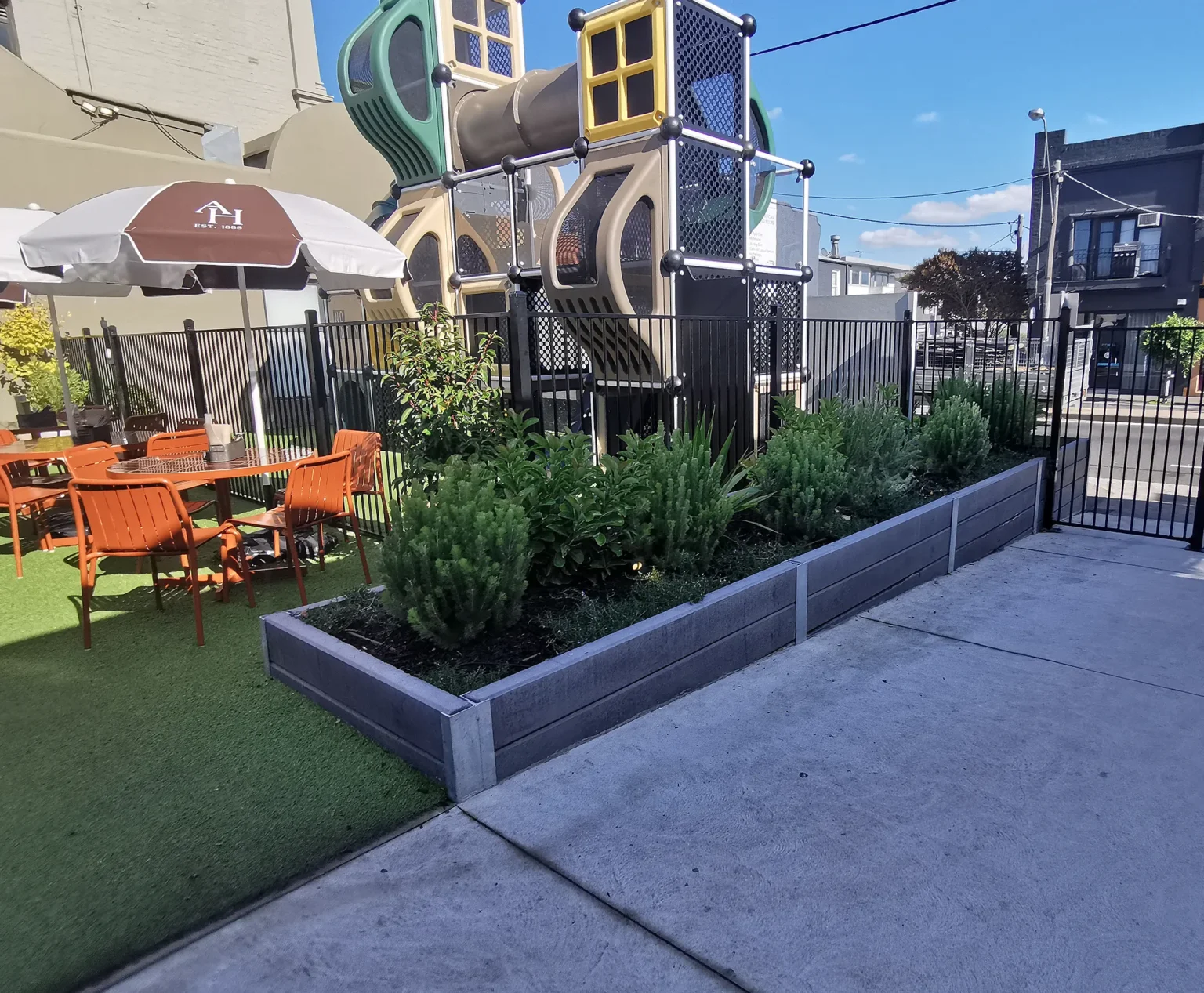 Small Retaining Wall Project in a Commercial Application for Auburn Hotel in Hawthorn East using Charcoal Smooth Concrete Sleepers in The Marina Range and Supplied by Sunset Sleepers