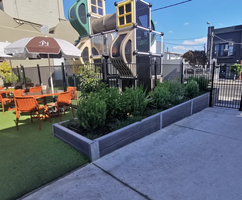 Small Retaining Wall Project in a Commercial Application for Auburn Hotel in Hawthorn East using Charcoal Smooth Concrete Sleepers in The Marina Range and Supplied by Sunset Sleepers