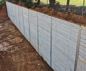 Gallery 8 Tall Heavy Duty Retaining Wall Project Using The Plain Grey Marina Smooth Concrete Sleepers and Supplied by Sunset Sleepers
