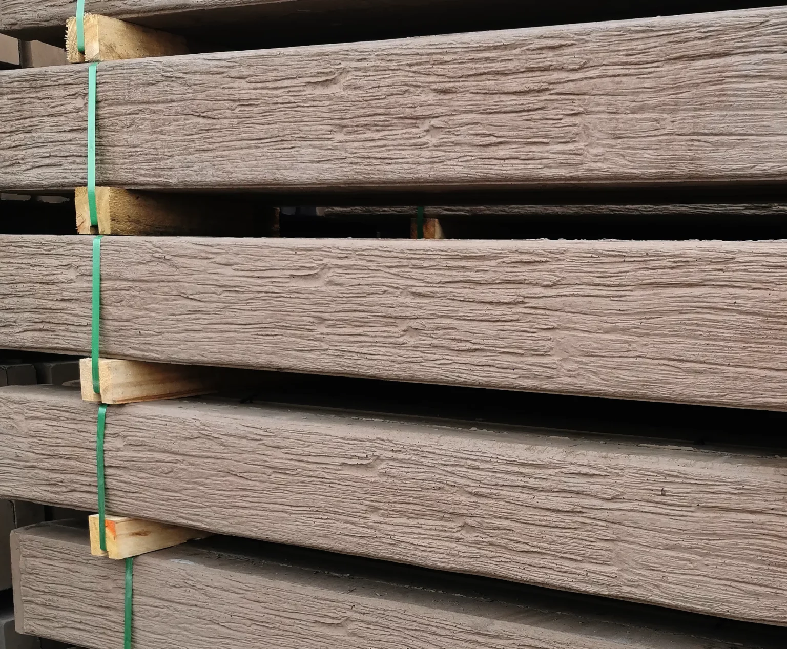 The Malibu Jasper Brown Woodgrain Concrete Sleepers Stock Waiting to be delivered on site Sunset Sleepers