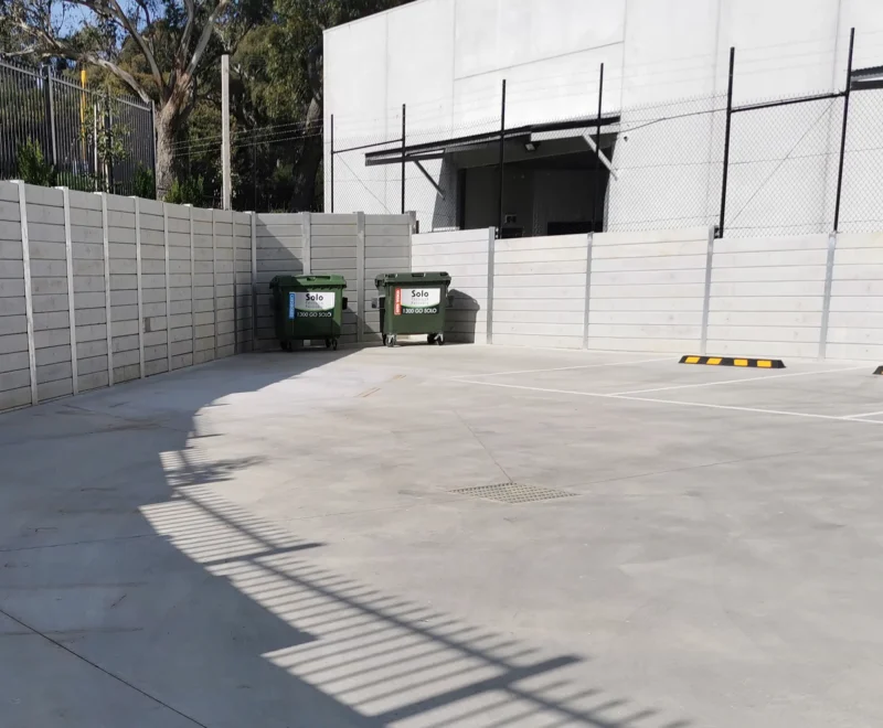 The Marina Smooth Concrete Sleeper in Plain Grey Used on an Industrial Factories Car Park Retaining Wall Project and Supplied by Sunset Sleepers