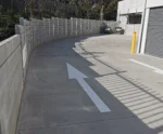 The Marina Smooth Concrete Sleeper in Plain Grey Used on an Industrial Factories Retaining Wall Project and Supplied by Sunset Sleepers
